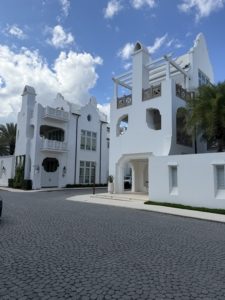Luxury beachfront balcony view overlooking the emerald waters and white sands of the 30A East corridor, representing premium property management.