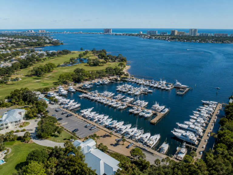 Aerial view of a marina and boats near Grand Lagoon and St. Andrews Bay in Panama City Beach